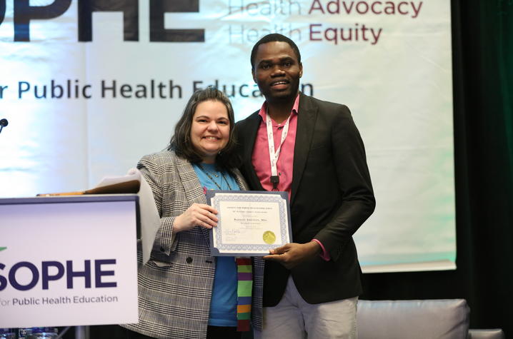 Raphael Adesiyan accepts a 21st Century Student Scholarship Award at the Society of Public Health Education annual conference.