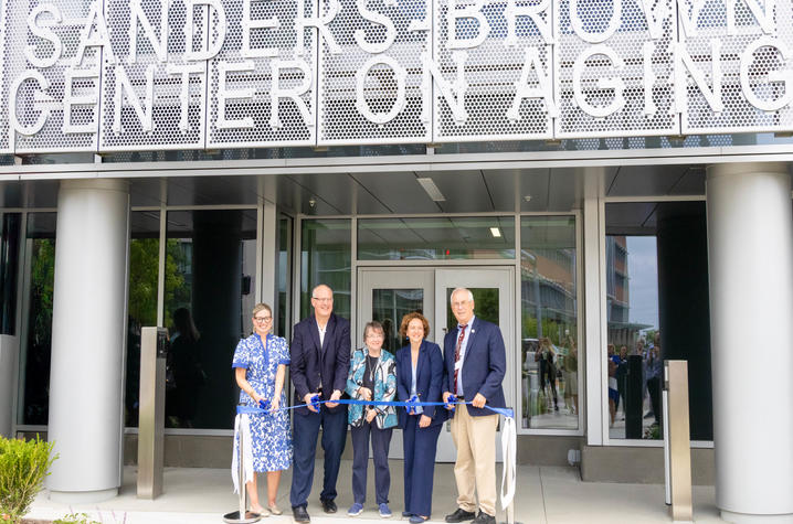 Carla Blanton, Pete Nelson, Linda Van Eldik, Ilhem Messaoudi and Chipper Griffith cut the ribbon on the renovated Sanders-Brown research facility.