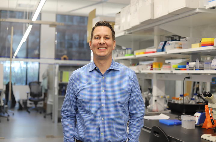 Lance Johnson standing in a lab