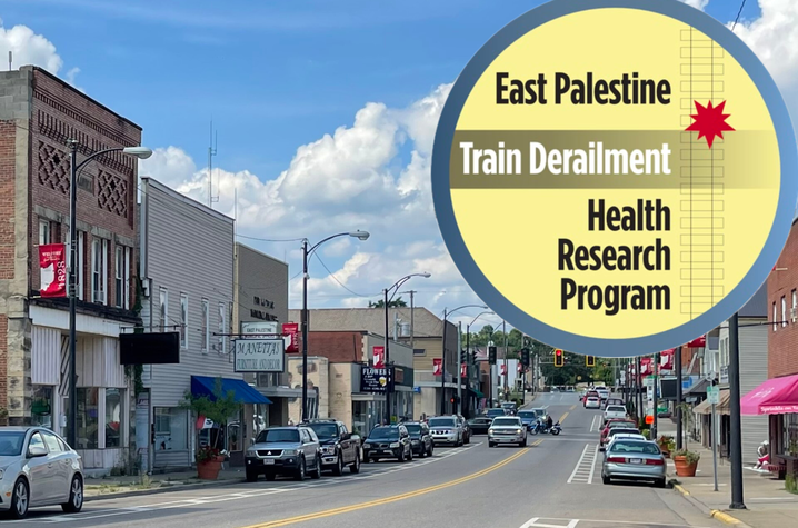 East Palestine Train Derailment Health Research Program logo over an image of a small city street with shop s and cars