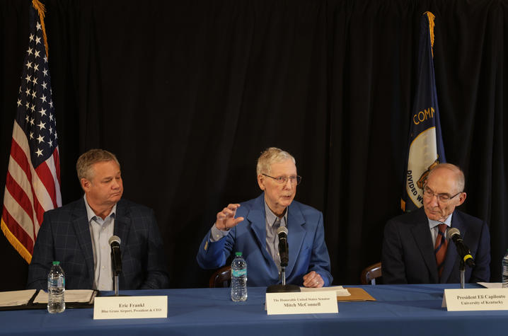 Eric Frankl, Mitch McConnell and Eli Capilouto sit at a panel table