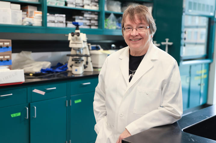 Linda Van Eldik, director of the UK Sanders-Brown Center on Aging, stands in a research laboratory.