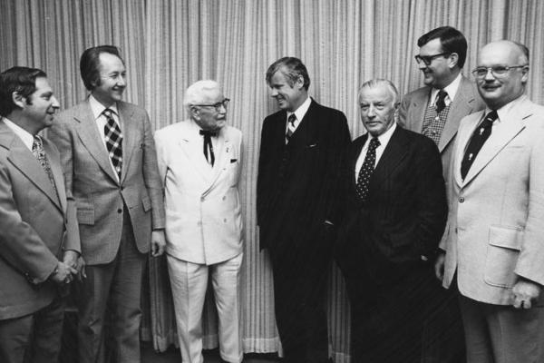 Col. Harland Sanders; Gov. John Y. Brown Jr.; John Y. Brown Sr.; UK VP Ray Hornback; and Medical Center Chancellor Peter Bosomworth at the building dedication. 