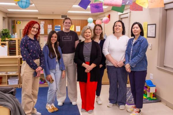 Jennifer Grisham, Ph.D., center, gave a tour of the UK Early Childhood Laboratory to researchers from across the U.S. and around the world during the AEPS Research Symposium.