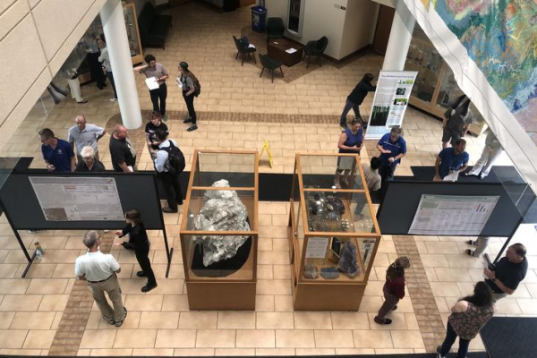 Students, faculty, staff and guests gather in the MMRB atrium to view research posters