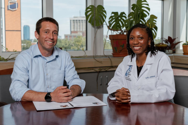 John Gensel and Lyric Johnson sitting at a table