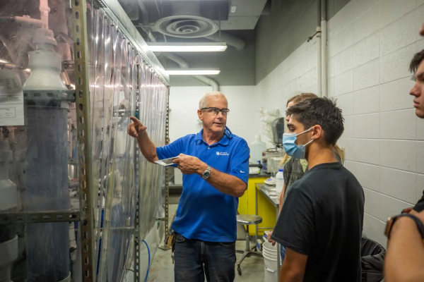 Jack Groppo in his lab with students