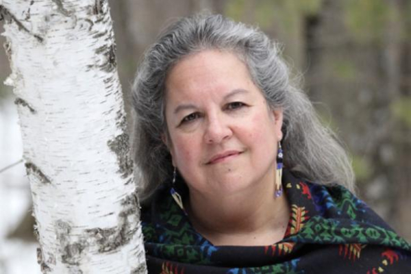 Robin Wall Kimmerer near a tree