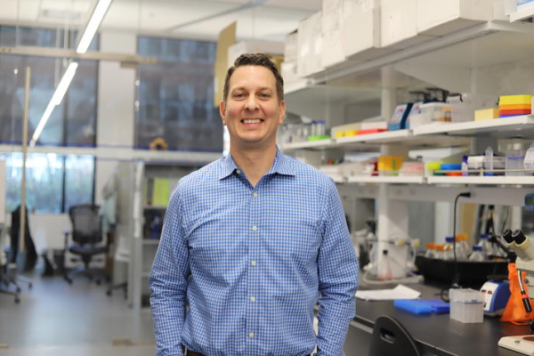 Lance Johnson standing in a lab