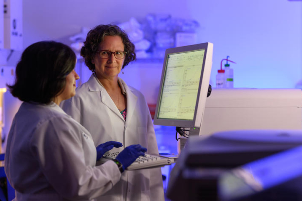 Barbara Nikolajczyk in a lab with another researcher at the Barnstable Brown Diabetes Center,