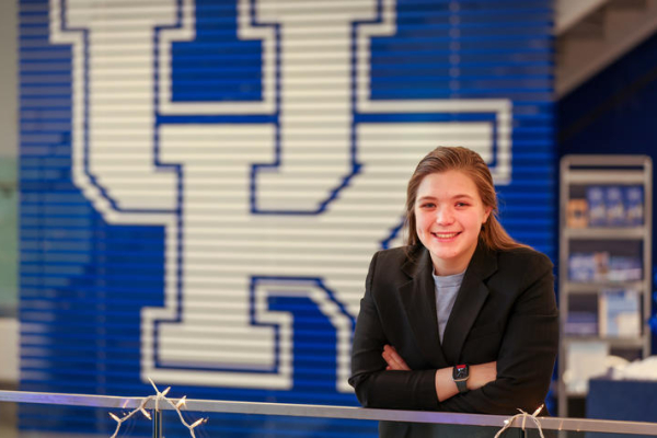 Lauren Roehr in front of a large UK logo