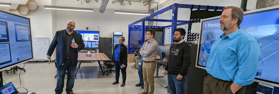  People standing in a manufacturing space