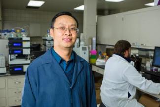 Jian Shi in his lab at UK