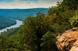 river through forested hills