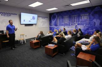 Marc Cormier presenting to UK Women's Volleyball team