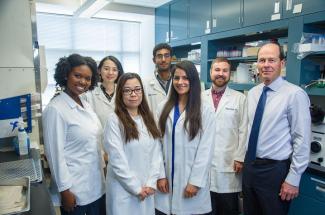 Picture of UK Superfund Research Center director Bernhard Hennig (right) with doctoral students who are part of the center’s “Project #1"