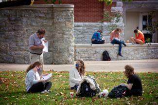 Photo of UK students in an outdoor class on campus in early November.