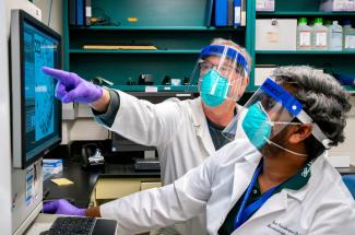 Photo of UK vaccine researcher Jerry Woodward in lab.