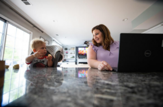 Health Sciences undergrad Brooke Poe works at her kitchen counter alongside her younger son, Rhodes. UK Photo | Pete Comparoni