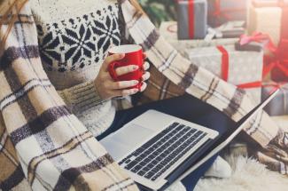 Getty Image of person with laptop in lap