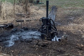 Orphaned oil well in Daviess County, Kentucky drilled in 1962. The well sits in an active farm field and presents a potential hazard to agricultural activities. | Photo by Marty Parris.