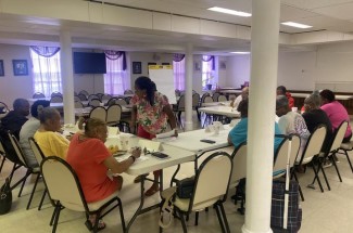 Yolanda Jackson (standing in the center) meets with focus group participants at First Baptist Church in Frankfort, Ky. Photo provided by Jackson.
