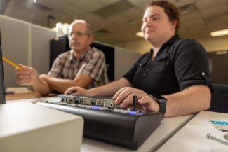 Dave Moecher, professor in the Department of Earth and Environmental Sciences, and Riley Grove, graduate student