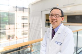 Markey medical oncologist Zhonglin Hao, M.D., Ph.D.