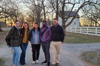 History graduate students, from left, Taylor Smith, Olivia Dale, McKenna Natzke and Dorian Gray, with Stephen Davis, associate professor of history.