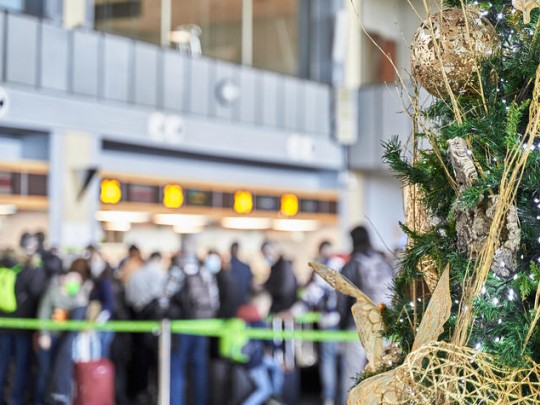 Christmas tree in a busy airport terminal