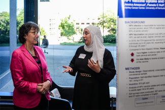 NIH Director Monica Bertagnolli talks with Bassema Abu-Farsakh, a College of Nursing graduate research assistant, about her tobacco use and lung cancer screening research.