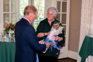 After recognizing the 14 faculty members with their University Research Professor awards, Eli Capilouto, UK President, presented Lisa Cassis, UK Vice President for Research, with flowers for her birthday.