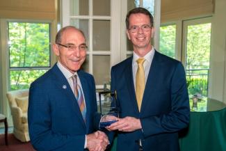 James Ziliak accepting the award from President Capilouto.