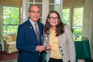 Susan Gardner accepting the award from President Capilouto.