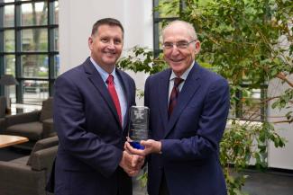 Neal H. Hutchens accepting the University Research Professor award from UK President Eli Capilouto.