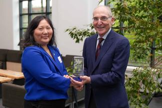 Donna Lee Kwon accepting the University Research Professor award from UK President Eli Capilouto.