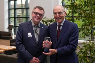 M. Paul Murphy accepting the University Research Professor award from UK President Eli Capilouto.