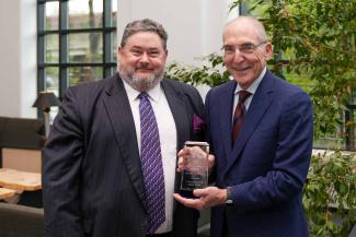 Michael D. Murray accepting the University Research Professor award from UK President Eli Capilouto.