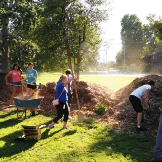 people landscaping in a field