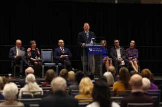 UK Board of Trustees Chair Britt Brockman speaking at the Sanders-Brown Center on Aging celebration