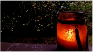 A dirty candle jar outdoors