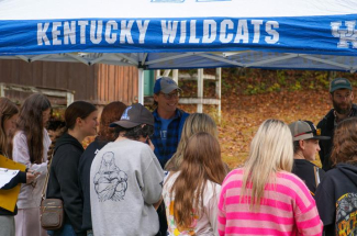 UK faculty members Lee Moser, middle, and Kenton Sena, right, interacting with students outside at the 2025 FLASH Field Day 