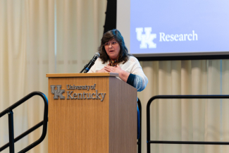 Kopana Terry speaking at a University of Kentucky podium