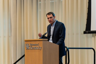 Daniel Vivian speaks behind a University of Kentucky podium