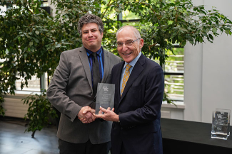 Scott Berry accepting an award from Eli Capilouto