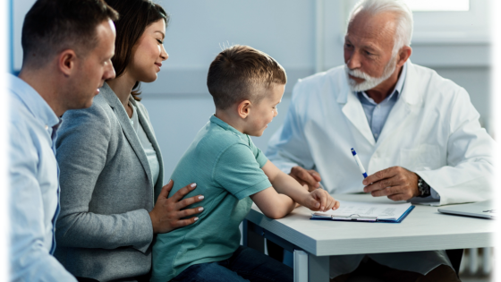 child and parents at a table with a doctor
